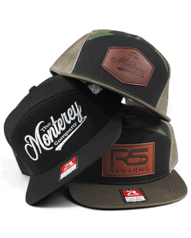 three custom hats stacked on top of eachother