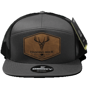 grey and black 7 panel hat with custom leather patch on front